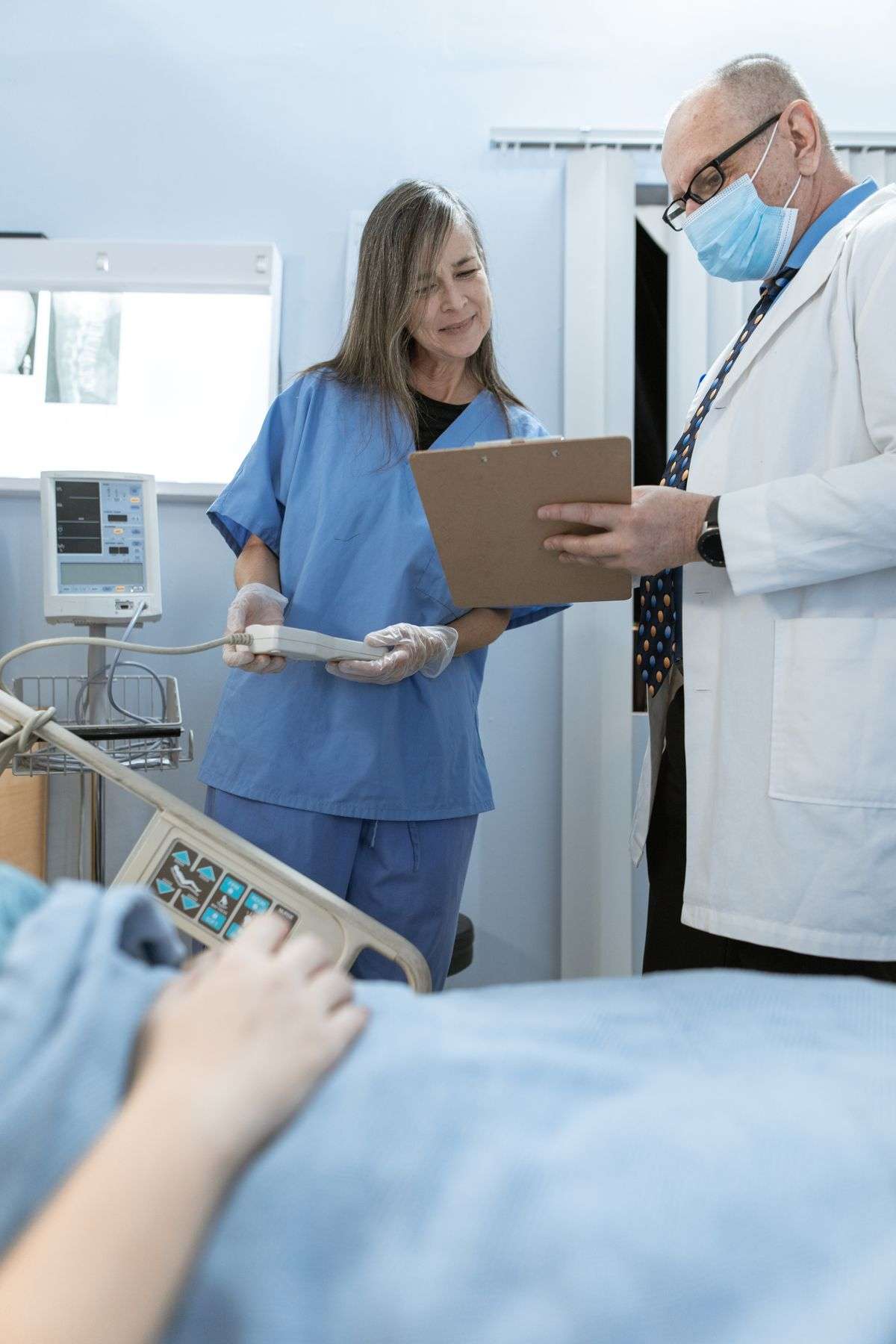 A doctor and a nurse working together in a hospital