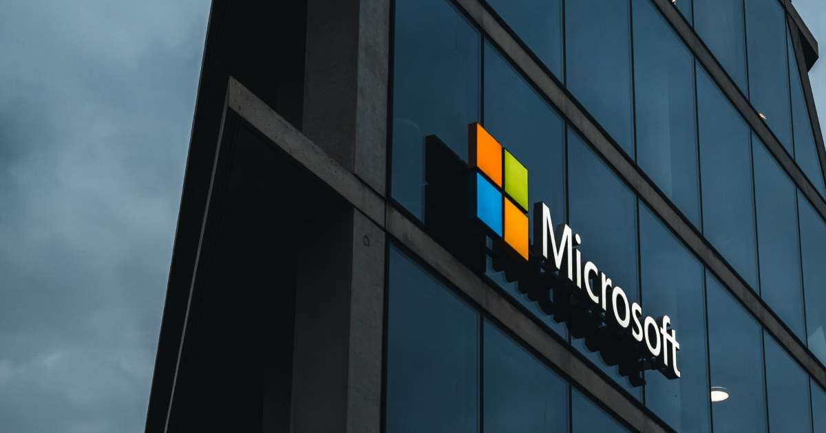 Microsoft logo on a glass office building