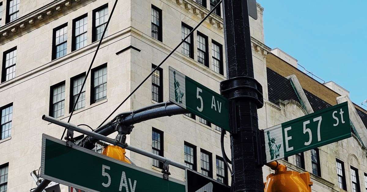 Fifth Avenue and East 57th Street street signs in Midtown Manhattan